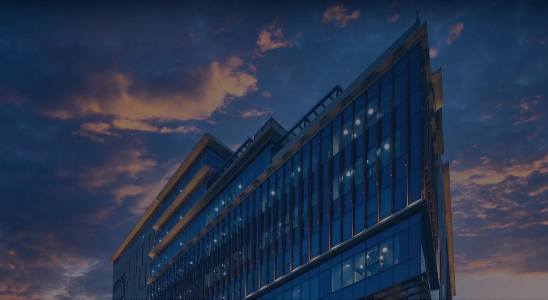 Manipal Hospital building exterior at dusk