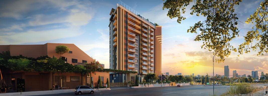 Vaishnavi Premiere apartment towers exterior at dusk
