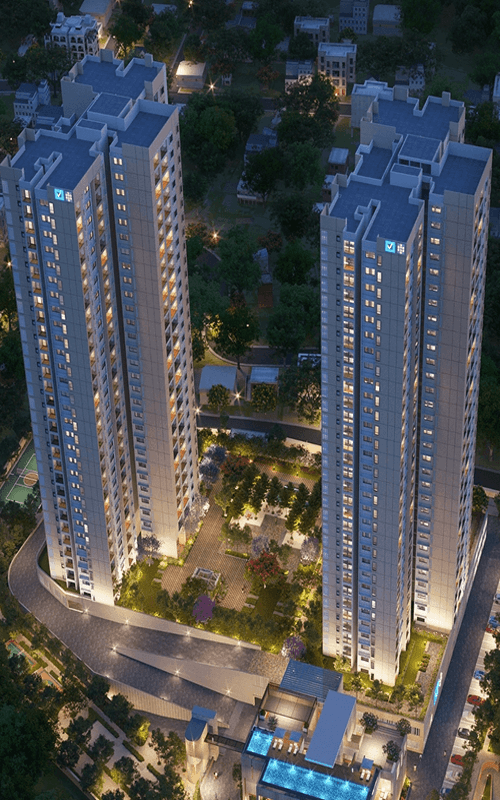 Vaishnavi at One Krishna Brindavan twin towers illuminated at night